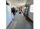 Long hallway with stone accent wall, showcasing unique architectural design and character at 4902 N 700 W, McCordsville, IN 46055