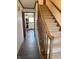 Hallway with staircase, dark wood floors and access to the kitchen at 4902 N 700 W, McCordsville, IN 46055