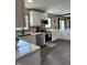 Bright and modern kitchen featuring white cabinets, stainless steel appliances, and granite countertops at 4902 N 700 W, McCordsville, IN 46055