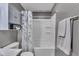 The bathroom features a tub/shower with shelves and a toiletry cabinet for ample storage at 4930 Founders Ct, Anderson, IN 46017