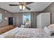 This bedroom features a ceiling fan and an armoire for storage at 4930 Founders Ct, Anderson, IN 46017