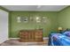 The bedroom features light-green walls, and an antique dresser at 4930 Founders Ct, Anderson, IN 46017