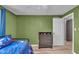 The bedroom features light-green walls, a ceiling fan, and a four-drawer dresser at 4930 Founders Ct, Anderson, IN 46017