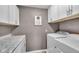 Clean and efficient laundry room with white cabinets, modern appliances, and granite countertops at 4930 Founders Ct, Anderson, IN 46017
