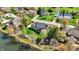 Stunning aerial view of a home nestled on a beautifully landscaped lot with a private pond and inviting deck area at 4932 Willow Ridge Ct, Zionsville, IN 46077