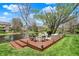 Inviting backyard featuring a wooden deck with stylish seating overlooking a tranquil pond and lush greenery at 4932 Willow Ridge Ct, Zionsville, IN 46077