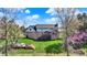 A sprawling backyard features a lush lawn, a deck, and patio great for outdoor living at 4932 Willow Ridge Ct, Zionsville, IN 46077
