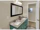 Bathroom featuring dual sinks, granite countertop, and a large mirror at 4932 Willow Ridge Ct, Zionsville, IN 46077