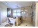 Beautiful bathroom featuring a freestanding tub, a separate glass-enclosed shower, and neutral tiling at 4932 Willow Ridge Ct, Zionsville, IN 46077