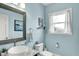 Bright half-bath with a unique vessel sink, granite countertops, and a decorative mirror at 4932 Willow Ridge Ct, Zionsville, IN 46077