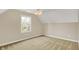 Bright bedroom featuring a window with a view, neutral walls, and plush carpet at 4932 Willow Ridge Ct, Zionsville, IN 46077