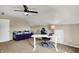 Bright bedroom featuring a white desk, comfortable chair, daybed and ceiling fan at 4932 Willow Ridge Ct, Zionsville, IN 46077