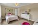 Bright bedroom featuring a comfortable bed, modern dresser, and stylish decor at 4932 Willow Ridge Ct, Zionsville, IN 46077