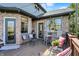 Cozy outdoor deck with stylish seating, string lights, and potted plants, perfect for entertaining or relaxing at 4932 Willow Ridge Ct, Zionsville, IN 46077