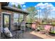 Charming deck with comfortable seating, offering a view of the serene backyard and surrounding landscape at 4932 Willow Ridge Ct, Zionsville, IN 46077