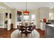Cozy dining room featuring a round table with seating for four and a jute rug at 4932 Willow Ridge Ct, Zionsville, IN 46077