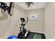Home exercise room equipped with an elliptical machine, TV and yoga mat at 4932 Willow Ridge Ct, Zionsville, IN 46077