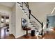Welcoming foyer with hardwood floors, staircase, and stylish decor at 4932 Willow Ridge Ct, Zionsville, IN 46077