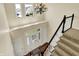 Spacious foyer with high ceilings, chandelier, staircase, and a decorative glass front door offering natural light at 4932 Willow Ridge Ct, Zionsville, IN 46077
