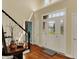 Inviting foyer with a beautiful front door, hardwood floors, and stairway at 4932 Willow Ridge Ct, Zionsville, IN 46077