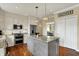 Beautiful kitchen with a large island, granite countertops, stainless appliances, and ample cabinet space at 4932 Willow Ridge Ct, Zionsville, IN 46077