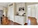 Charming kitchen bar area with custom cabinets, granite countertops, and a built-in wine rack at 4932 Willow Ridge Ct, Zionsville, IN 46077