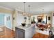 Open-concept kitchen with a large island, stainless steel appliances, and an inviting dining area at 4932 Willow Ridge Ct, Zionsville, IN 46077