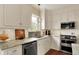 Well-appointed kitchen with granite countertops, stainless steel appliances, and white cabinetry at 4932 Willow Ridge Ct, Zionsville, IN 46077