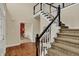 Elegant staircase with wooden railing and steps leading to the second floor at 4932 Willow Ridge Ct, Zionsville, IN 46077
