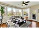 Sun-drenched sun room with views of the outdoors, hardwood floors, and stylish decor at 4932 Willow Ridge Ct, Zionsville, IN 46077