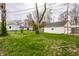 Spacious backyard with green grass and a detached white garage at 5140 Indianola Ave, Indianapolis, IN 46205