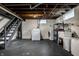 Unfinished basement with utility hook ups including washer and dryer at 5140 Indianola Ave, Indianapolis, IN 46205
