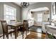 Charming dining room with wooden table and chairs, flowing into the adjacent kitchen at 5140 Indianola Ave, Indianapolis, IN 46205