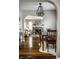 Dining and living area featuring hardwood floors, neutral walls, and seamless flow to other spaces at 5140 Indianola Ave, Indianapolis, IN 46205