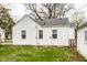 Exterior of the house features a white facade with neutral trim at 5140 Indianola Ave, Indianapolis, IN 46205