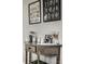 Stylish console table with decorative accents and framed artwork in the dining room at 5140 Indianola Ave, Indianapolis, IN 46205