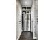 View of a stainless steel refrigerator in a recessed space, maximizing kitchen storage and efficiency at 5140 Indianola Ave, Indianapolis, IN 46205