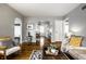 Open-concept living room showcasing hardwood floors, neutral tones, and seamless flow to other spaces at 5140 Indianola Ave, Indianapolis, IN 46205