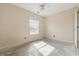 A bedroom is shown with a ceiling fan and a window at 5213 Milhouse Rd, Indianapolis, IN 46221