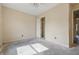A bedroom is shown with a ceiling fan, a window, and a closet at 5213 Milhouse Rd, Indianapolis, IN 46221