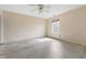 A bedroom is shown with a ceiling fan and a window at 5213 Milhouse Rd, Indianapolis, IN 46221