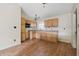 Kitchen featuring wood cabinets, a sink, a window and a ceiling fan with overhead lighting at 5213 Milhouse Rd, Indianapolis, IN 46221
