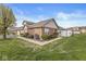 Well-maintained exterior featuring lush landscaping, a brick facade, and a cozy fenced patio for outdoor enjoyment at 5324 Rolling Meadow Blvd, Indianapolis, IN 46237