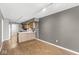 Open kitchen and living space featuring wood cabinets and hardwood floors at 5324 Rolling Meadow Blvd, Indianapolis, IN 46237
