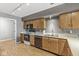 Kitchen featuring stainless steel appliances, wood cabinets, and hardwood floors at 5324 Rolling Meadow Blvd, Indianapolis, IN 46237