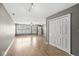 Bright living room with hardwood floors, neutral paint, and multiple windows for natural light at 5324 Rolling Meadow Blvd, Indianapolis, IN 46237