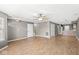 Spacious open concept living area with hardwood floors, neutral walls, and seamlessly connecting to the kitchen at 5324 Rolling Meadow Blvd, Indianapolis, IN 46237