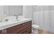 Modern bathroom featuring a sleek vanity with a vessel sink and a white shower curtain at 549 Keystone Ave, Indianapolis, IN 46201