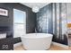 Beautiful bathroom features a soaking tub and an elegant chandelier at 549 Keystone Ave, Indianapolis, IN 46201