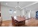 Dining room with hardwood floors, large table, white walls, and recessed lighting at 549 Keystone Ave, Indianapolis, IN 46201